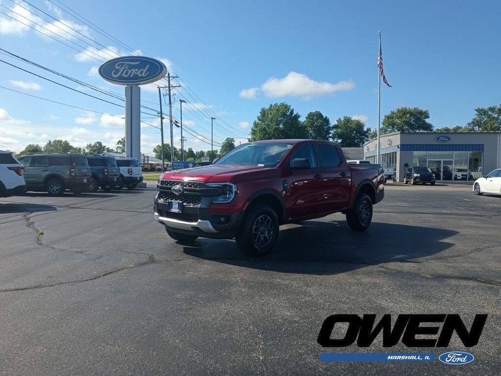 2026 Ford Ranger XLT in Ruby Red Metallic Tinted Clearcoat — front three-quarter view