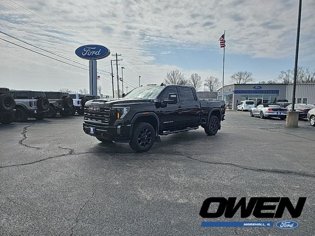 2024 GMC Sierra 2500HD AT4 in Onyx Black — front three-quarter view